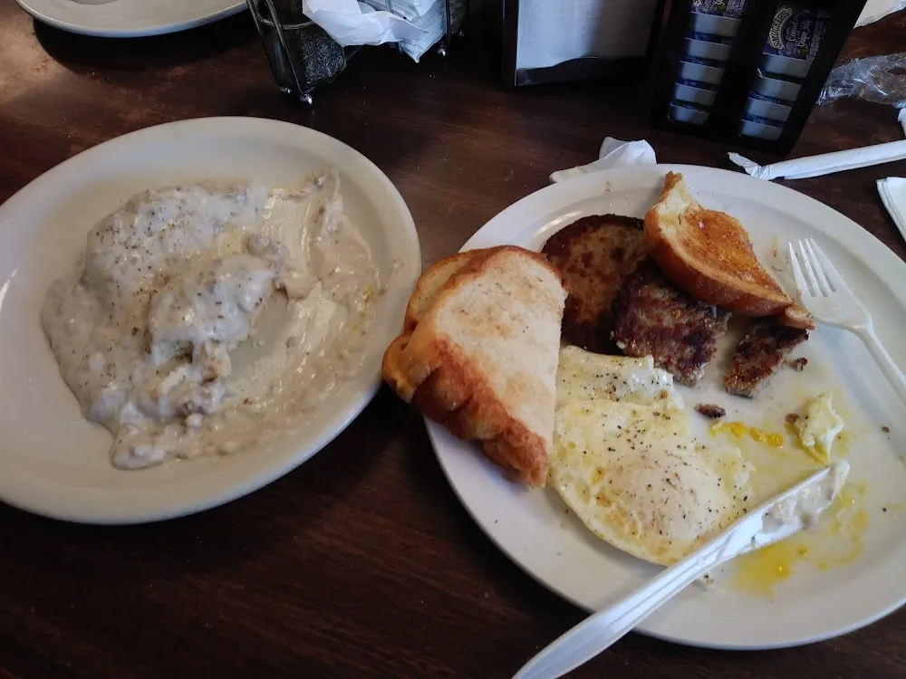 Biscuit and Gravy Fried Eggs Sausage and Toast